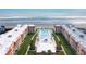 Aerial view of condo building, pool, and beach access at 3801 S Atlantic Ave # 321, New Smyrna Beach, FL 32169