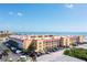 Aerial view of beachfront condo building with parking and ocean views at 3801 S Atlantic Ave # 321, New Smyrna Beach, FL 32169