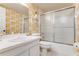 Bathroom with floral wallpaper and shower/tub combo at 3801 S Atlantic Ave # 321, New Smyrna Beach, FL 32169