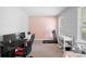 Home office with a workspace, treadmill, and baby changing station at 11109 Folklore St, Winter Garden, FL 34787