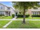 Two-story house with gray siding, blue door, and landscaped yard at 11109 Folklore St, Winter Garden, FL 34787