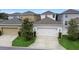 Attached garage with driveway and landscaping at 11109 Folklore St, Winter Garden, FL 34787