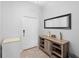Inviting entryway with storage and mirror at 11109 Folklore St, Winter Garden, FL 34787
