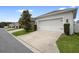 Attached garage with driveway and landscaping at 11109 Folklore St, Winter Garden, FL 34787
