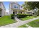 Two-story house with gray siding and a green lawn at 11109 Folklore St, Winter Garden, FL 34787