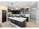 Updated kitchen boasts dark cabinetry, white countertops, and an island at 11109 Folklore St, Winter Garden, FL 34787