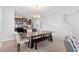 Spacious dining area with a large table, bench seating, and kitchen views at 11109 Folklore St, Winter Garden, FL 34787
