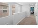 Upstairs hallway with neutral decor and access to bedrooms at 11109 Folklore St, Winter Garden, FL 34787