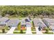 Aerial view of homes with solar panels and wooded backdrop at 2361 Crescent Moon St, Kissimmee, FL 34746