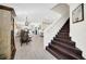 Modern dark wood staircase leading to upper level at 7706 Graben St, Kissimmee, FL 34747