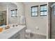 Clean bathroom with walk in shower, toilet, and vanity at 7706 Graben St, Kissimmee, FL 34747