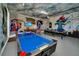 Game room with air hockey, foosball, ping pong, and murals at 7706 Graben St, Kissimmee, FL 34747