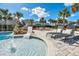 Resort-style pool with a waterslide, lounge chairs, and a patio at 7706 Graben St, Kissimmee, FL 34747