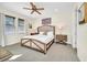 Spacious bedroom with king-size bed and ceiling fan at 7706 Graben St, Kissimmee, FL 34747