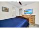 Bedroom with a navy blue comforter and built-in dresser at 7706 Graben St, Kissimmee, FL 34747