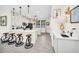 Open concept kitchen with white cabinets and island at 7706 Graben St, Kissimmee, FL 34747