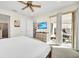 Main bedroom with patio access and large TV at 7706 Graben St, Kissimmee, FL 34747