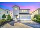 Two-story home with stone accents and a two-car garage at 7706 Graben St, Kissimmee, FL 34747