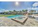 Relaxing spa and refreshing pool with lounge chairs at 7706 Graben St, Kissimmee, FL 34747