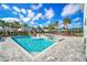 Large pool with water features, spa, and lounge chairs at 7706 Graben St, Kissimmee, FL 34747