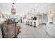 Open concept kitchen with white cabinets and island at 7706 Graben St, Kissimmee, FL 34747
