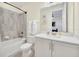 Bathroom with a shower/tub combo and white vanity at 7706 Graben St, Kissimmee, FL 34747