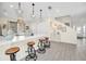 Kitchen island with seating and white quartz countertops at 7706 Graben St, Kissimmee, FL 34747