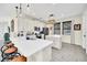 Modern kitchen with white cabinets, stainless steel appliances, and an island at 7706 Graben St, Kissimmee, FL 34747