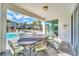 Patio with table and chairs overlooking the pool area at 7706 Graben St, Kissimmee, FL 34747