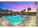 Resort-style pool with a slide, spa, and patio area at 7706 Graben St, Kissimmee, FL 34747