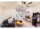 Spacious game room featuring a comfy couch, large TV, and arcade game at 7143 Oakmoss Loop, Davenport, FL 33837