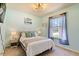 Bright bedroom with a queen-size bed and natural light at 7143 Oakmoss Loop, Davenport, FL 33837