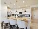 Kitchen island with seating for four, perfect for casual dining at 7143 Oakmoss Loop, Davenport, FL 33837