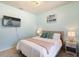 Cozy bedroom with a queen-size bed and calming decor at 7143 Oakmoss Loop, Davenport, FL 33837