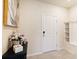 Bright and spacious entryway with a bench and shelving unit at 7143 Oakmoss Loop, Davenport, FL 33837