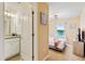 Bedroom with ensuite bathroom and lake view at 7143 Oakmoss Loop, Davenport, FL 33837