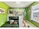 Jungle-themed bedroom with bunk beds and a slide at 7143 Oakmoss Loop, Davenport, FL 33837