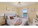 Bedroom with lake view and neutral decor at 7143 Oakmoss Loop, Davenport, FL 33837