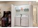 Convenient laundry room with washer and dryer at 7143 Oakmoss Loop, Davenport, FL 33837
