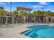 Gated entrance to the community pool area with lounge chairs at 7143 Oakmoss Loop, Davenport, FL 33837