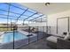 Private screened pool and patio with lounge chairs, ideal for relaxation at 7143 Oakmoss Loop, Davenport, FL 33837