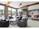 Outdoor patio with comfortable seating and a fireplace at 7143 Oakmoss Loop, Davenport, FL 33837