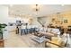 Open concept living room and kitchen with modern finishes at 7143 Oakmoss Loop, Davenport, FL 33837