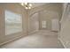 Spacious dining room with large window and neutral decor at 889 Park Grove Ct, Orlando, FL 32828
