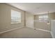 Spacious loft area with window and neutral color palette at 889 Park Grove Ct, Orlando, FL 32828