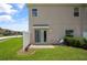 Private patio and small yard with lawn at 889 Park Grove Ct, Orlando, FL 32828