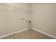Empty laundry room with tile floor, shelving, and plumbing hookups at 889 Park Grove Ct, Orlando, FL 32828
