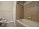 Bathroom with tub, tiled walls, and dark wood vanity at 889 Park Grove Ct, Orlando, FL 32828