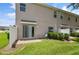 Private patio and small yard with lawn at 889 Park Grove Ct, Orlando, FL 32828