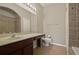 Bathroom with double vanity, toilet and tub shower combo at 889 Park Grove Ct, Orlando, FL 32828